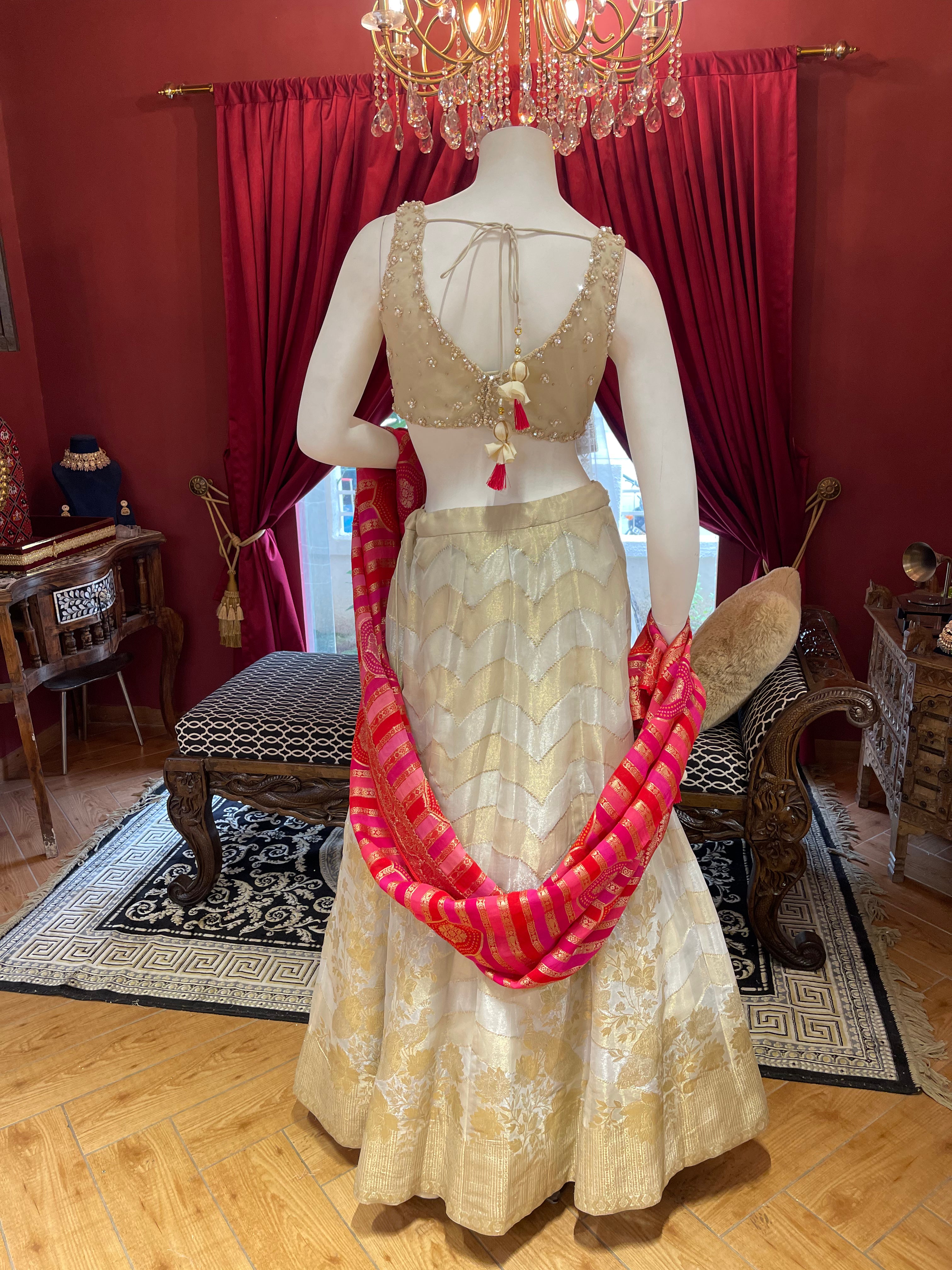 Ivory Tissue Lehenga With Full Handwork Blouse And Red Leheriya Dupatta