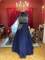 Midnight Blue Pleated Gown with Silver Leaf Embellishments