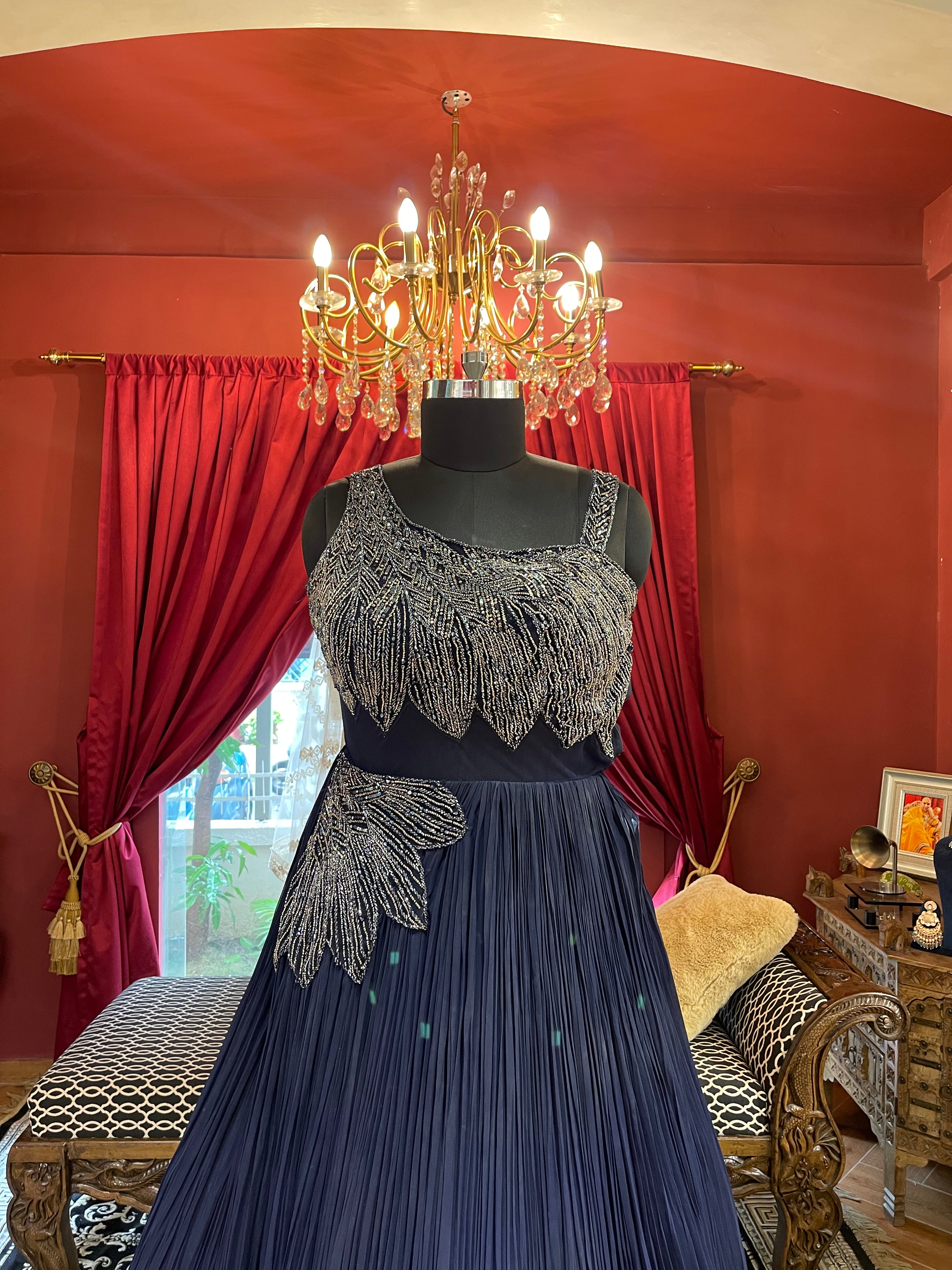 Midnight Blue Pleated Gown with Silver Leaf Embellishments